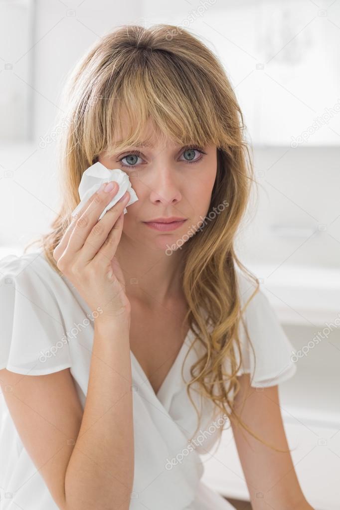 Portrait of a sad young woman crying