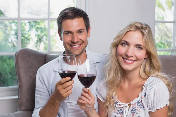 Young couple with wine glasses at home — Stock Photo, Image