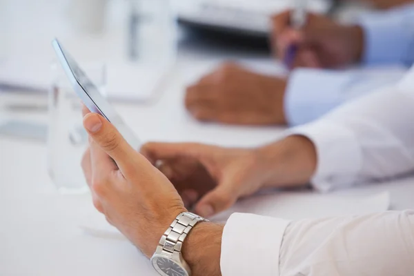 Close-up mid section of business people in meeting — Stock Photo, Image