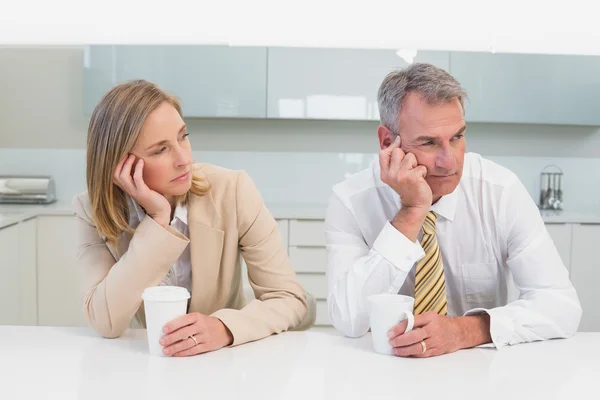 Business couple not talking after an argument in kitchen — Stock Photo, Image