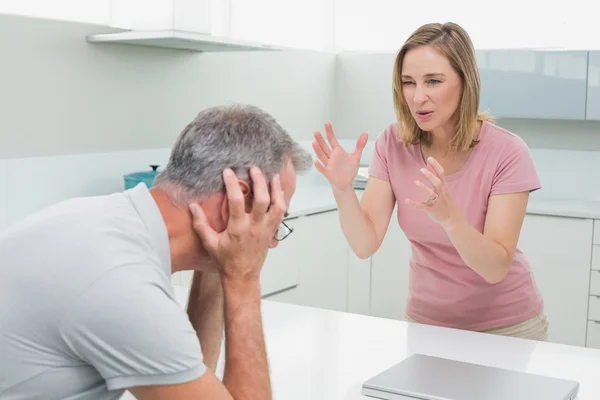 Unhappy couple having an argument in kitchen — Stok fotoğraf