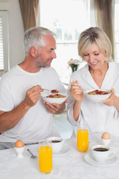 Happy mature couple having breakfast — Stock Photo, Image