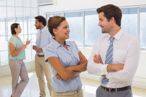 Portrait of a business couple with colleagues at office Royalty Free Stock Images