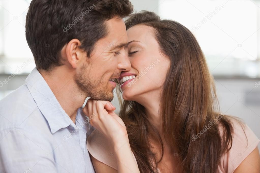 Loving young couple about to kiss