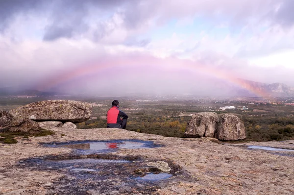 Man contemplating the rainbow — Stock Photo, Image