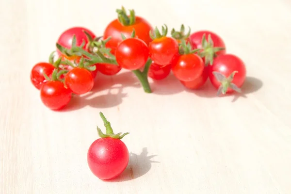 Colourful tomatoes on a table — Stock Photo, Image