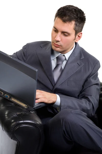 Homem de negócios com um laptop — Fotografia de Stock