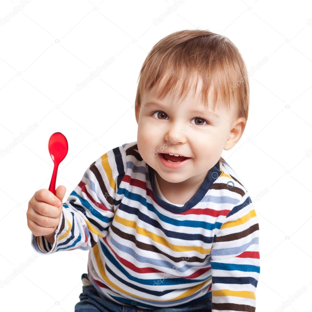 baby holding spoon