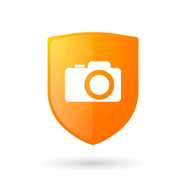 Icona dello scudo con una fotocamera fotografica — Vettoriale Stock