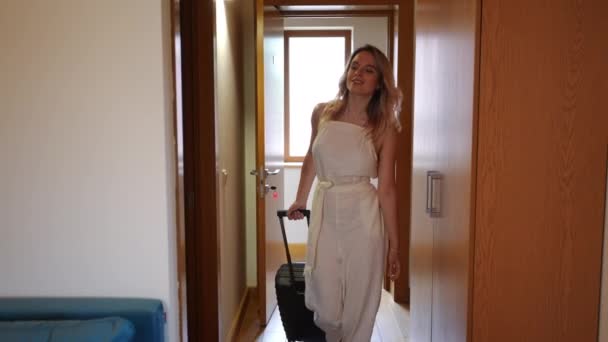 Smiling Beautiful Young Woman Luggage Entering Hotel Room Looking Front — Stok video