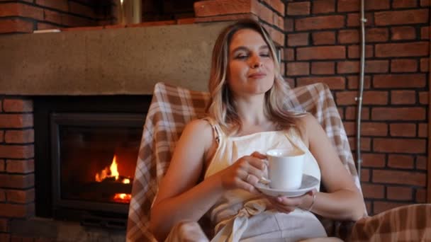Smiling Charming Woman Looking Away Sitting Tea Cup Rocking Chair — стокове відео