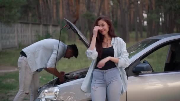 Portrait Beautiful Sad Woman Standing Broken Car Man Repairing Vehicle — Stock video