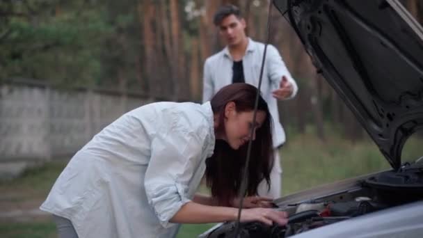 Side View Confident Young Woman Repairing Automobile Leaning Open Car — Vídeo de Stock