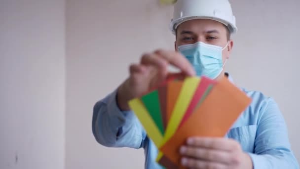 Builder Coronavirus Face Mask Choosing Color Walls Painting Standing New — Stock Video