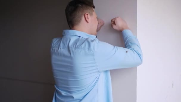Troubled Stressed Angry Man Hitting Wall Talking Standing Indoors Portrait — Stockvideo