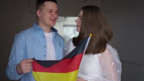 Positive Confident Millennial Couple Posing German Flag New Apartment Medium — Stok video