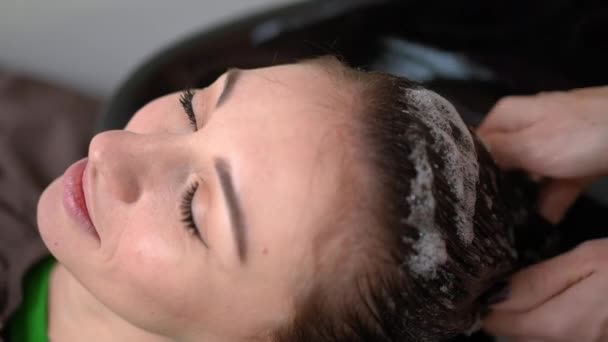 Close Young Beautiful Woman Satisfied Facial Expression Hands Hairdresser Massaging — Stockvideo