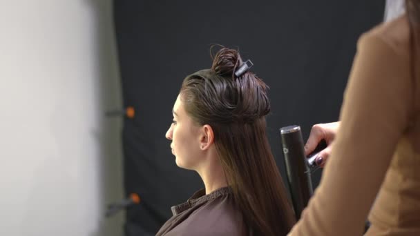Side View Woman Rubbing Nose Hairdresser Drying Hair Slow Motion — Vídeos de Stock