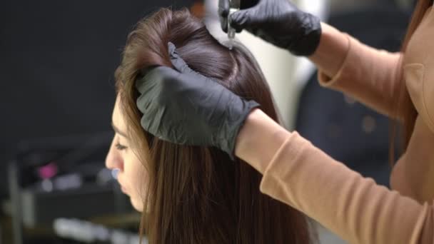 Unrecognizable Slim Female Hairdresser Applying Moisturizer Rubbing Skin Head Client — Stock Video