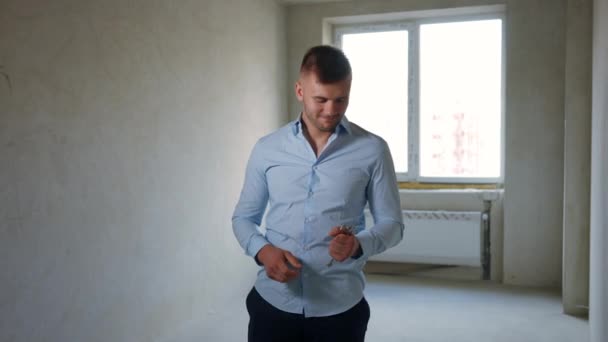 Portrait Satisfied Caucasian Young Man Standing New Flat Key Looking — Stock Video