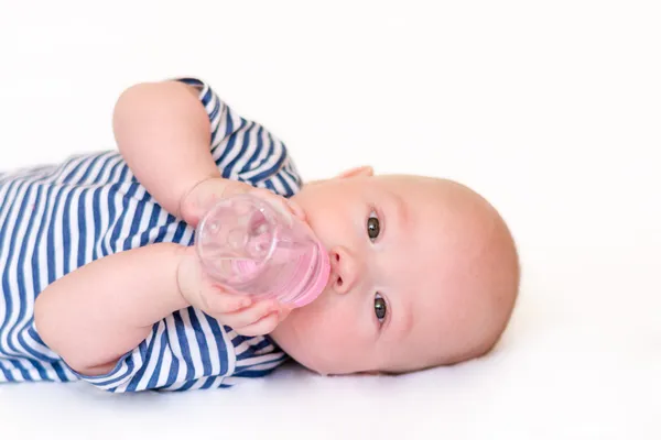 Newborn baby with a bottle — ストック写真