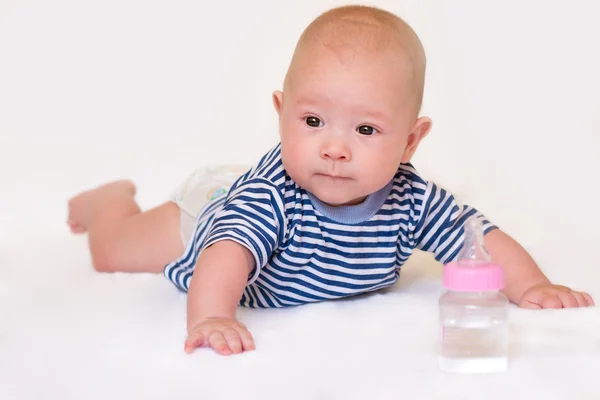 Newborn baby with a bottle — ストック写真