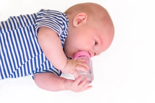 Newborn baby with a bottle — ストック写真