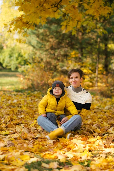 Happy Young Mother Little Son Sitting Autumn Park Yellow Maple — Stock Photo, Image