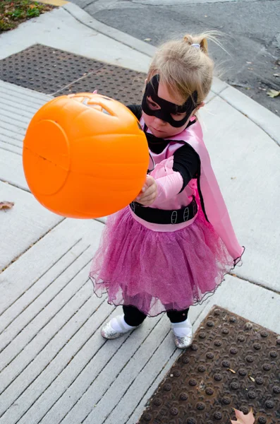 Little girl in halloween costume: where is the candy? — Stock Photo, Image