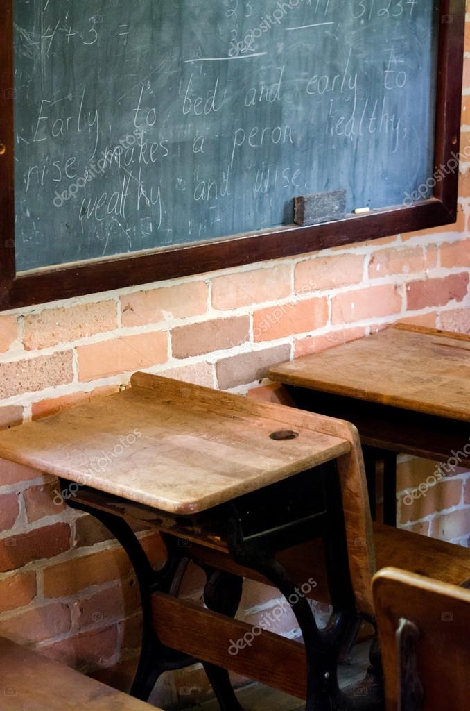 Desks And Black Board In An Old School House Stock Photo