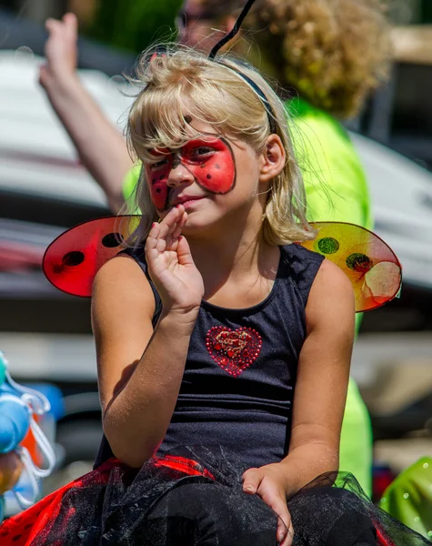 Beautiful bug girl in a parade — Stock Photo, Image