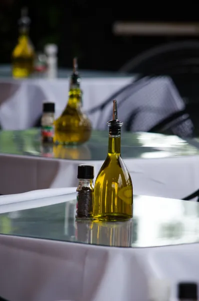 Olive oil and spices at an italian restaurant — Stock Photo, Image