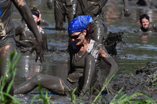 Woman falling in the mud — Stock Photo, Image