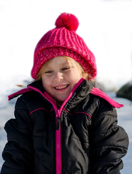 Šťastná holčička na bílém pozadí — Stock fotografie