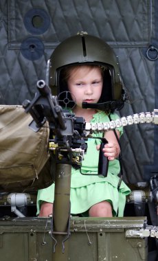 Little girl shooting a machine gun clipart