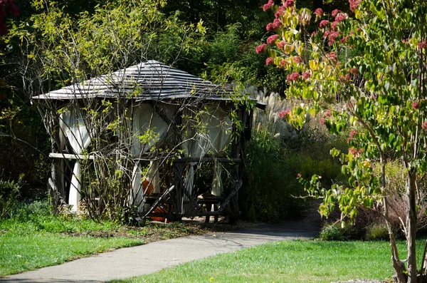 Rustic gazebo in the woods — Stock Photo, Image