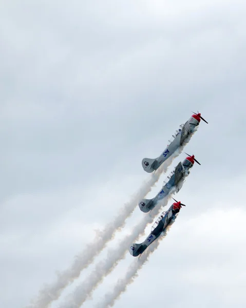 Airplanes soar strsight up  at an air show in Kalamazoo michigan — Stock Photo, Image