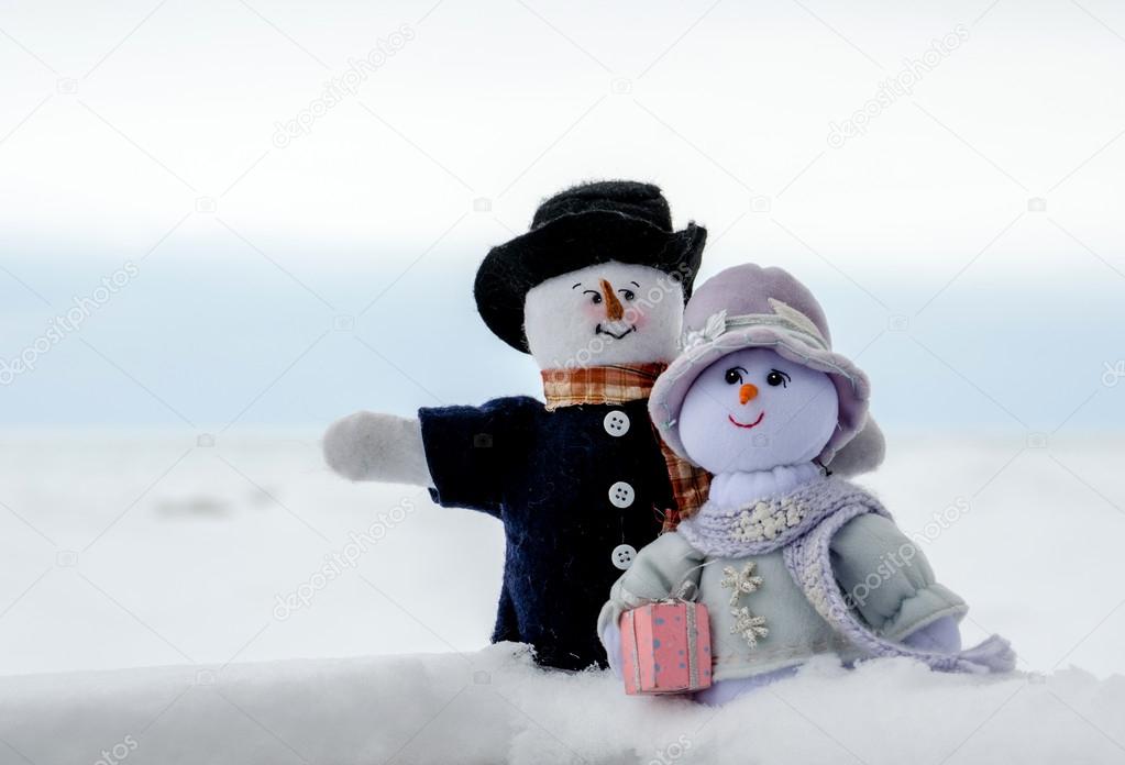 Snowman couple outdoors in the snow