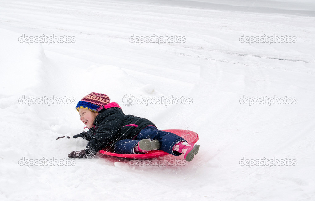Child on sled, wipe out