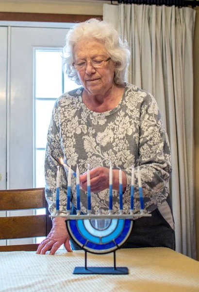 Jewish Grandmother Lights Candles Her Glass Menorah — Foto de Stock