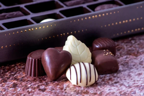 Box of luxury chocolate showcases the sweet treats inside