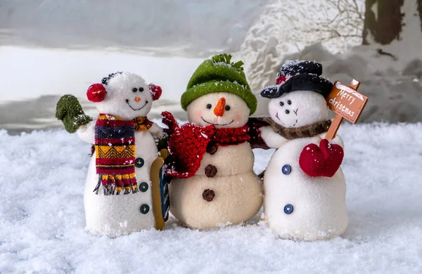 Trio Happy Snowmen Friends Hug Stand Middle Snowy Winter Landscape — стоковое фото