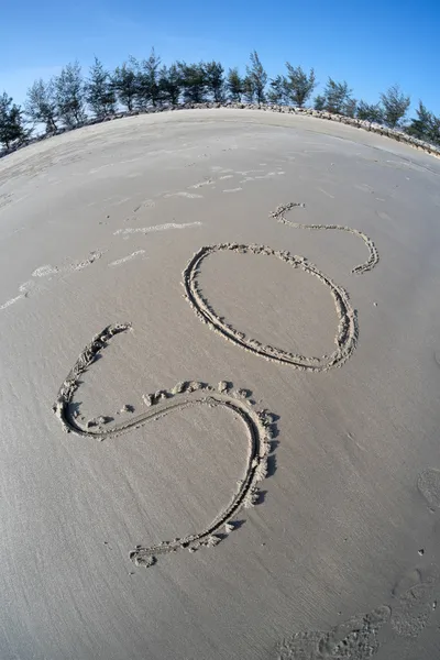 Ritning på sea sand — Stockfoto