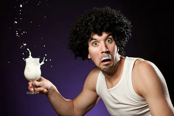 Man with mustache that got caught while he was drinking a glass of milk — Stock Photo, Image