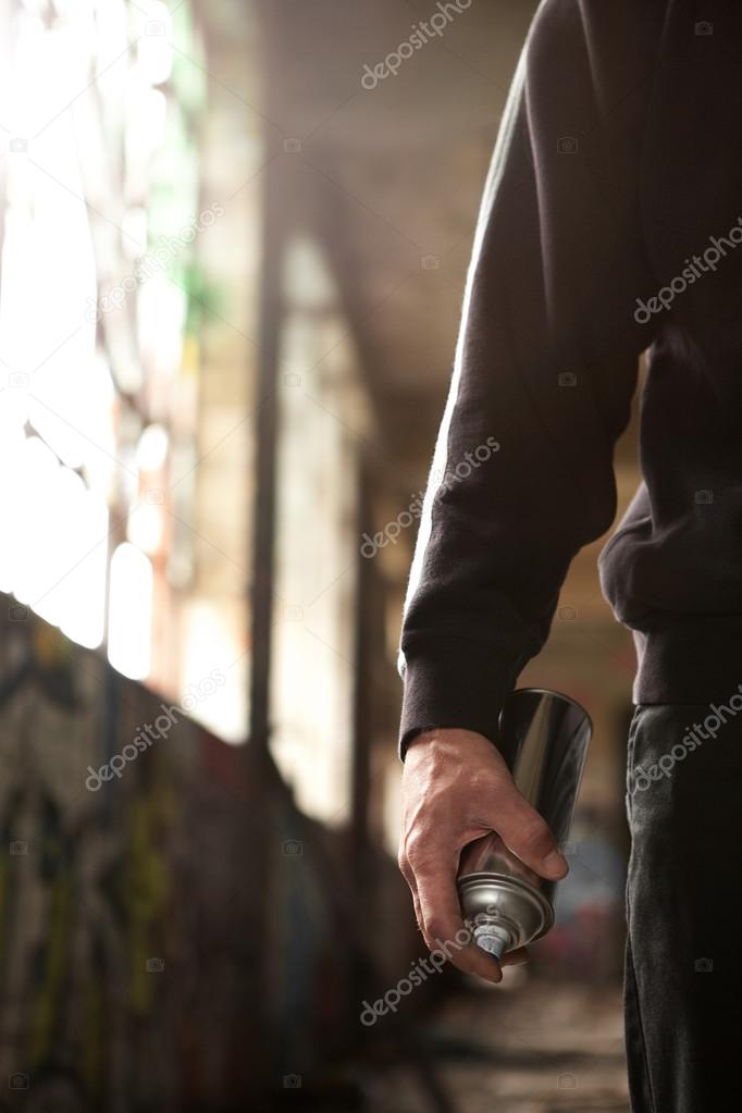 Young man hand ready to do a Graffiti