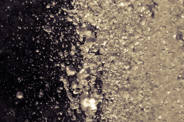 Water splashes into thousand drops — Stock Photo, Image