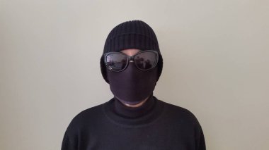 young woman in black mask on her face 