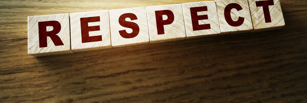 Respect word written on wood block. respect text on table, Business ethics concept.