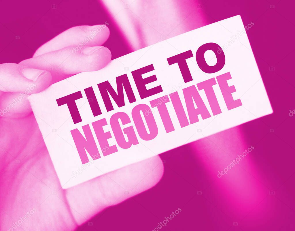 Time to negotiate words on a card in businessman's pocket. Compromise in business concept.