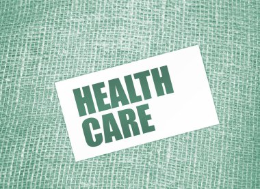 Çuval bezi tuvalinde sağlık hizmeti kelimeleri yazılı. tıp konsepti.